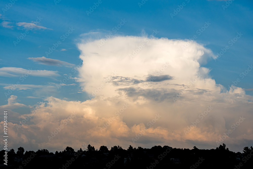 Storm cumulonimbus cloud on blue sky