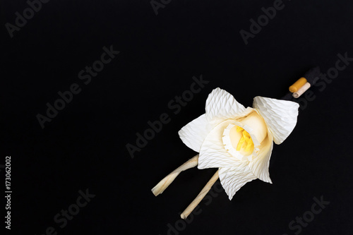 Fototapeta Naklejka Na Ścianę i Meble -  Kind of wood flower isolated on black background; to be placed on the site of cremation in Thailand. (Dok Mai Jan)