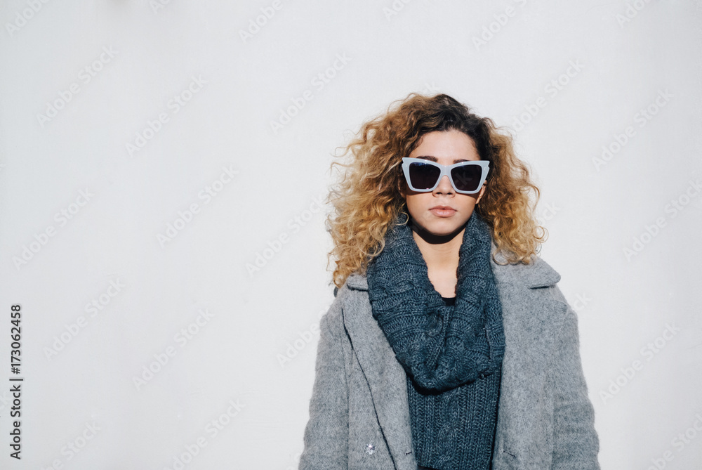 Beautiful Young Woman With Sunglasses and Curly Hair