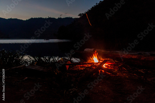 Fototapeta Naklejka Na Ścianę i Meble -  Campfire by Laguna Brava (Yolnabaj) lake, Guatemala