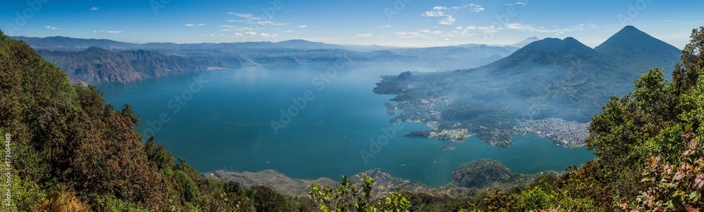 Fototapeta premium Atitlan lake in Guatemala, picture taken from San Pedro volcano. Volcanoes Cerro de Oro, Toliman, Atitlan at the right side.