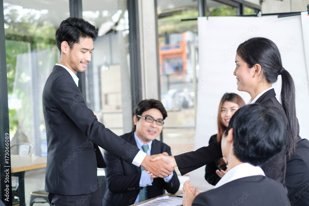 Welcome to board! Asian business people shaking hands with new partner meeting time after agree join new startup project,business colleagues teamwork concept Welcome to board! Asian business people shaking hands with new partner meeting time after agree join new startup project,business colleagues teamwork concept