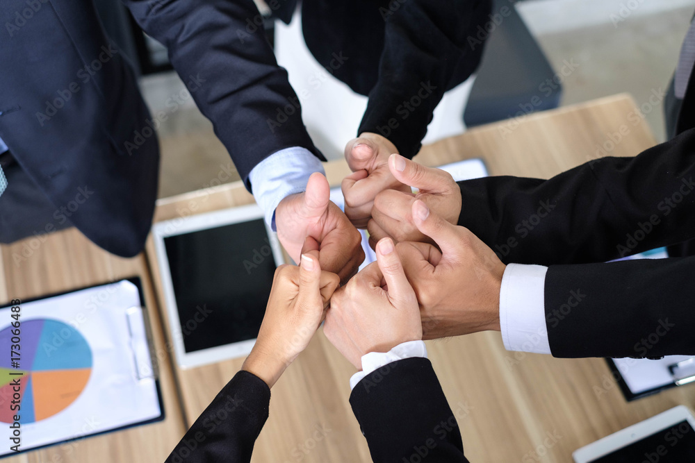 Asian business people joining hands with colleagues together at meeting time for develop job to success, business colleagues teamwork concept Asian business people joining hands with colleagues together at meeting time for develop job to success, business colleagues teamwork concept