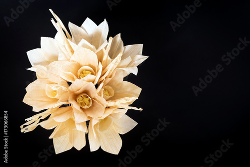 Fototapeta Naklejka Na Ścianę i Meble -  Kind of wood flower isolated on black background; to be placed on the site of cremation in Thailand. (Dok Mai Jan)