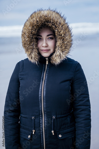 Young Woman Winter Beach Portrait photo