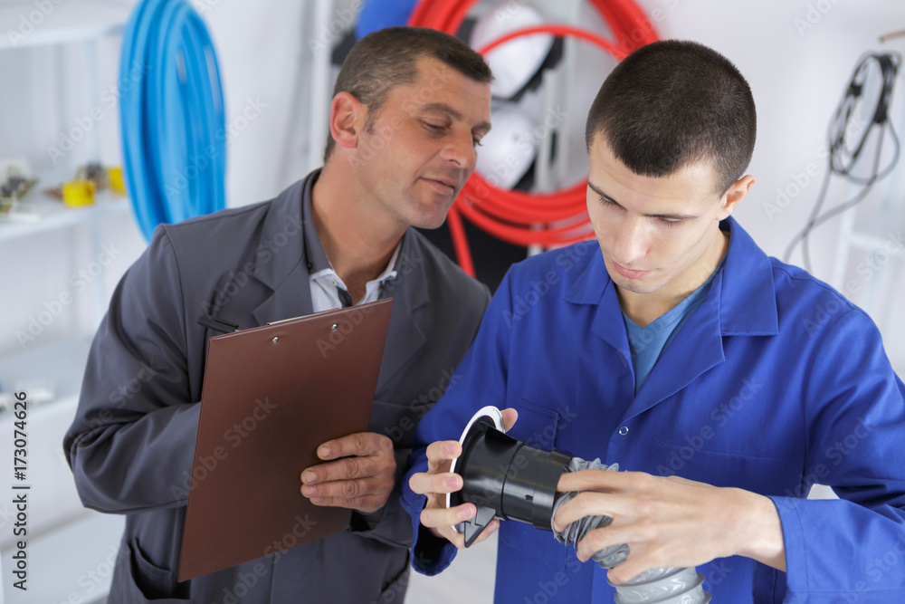 ac apprentice learning how to fit pipes