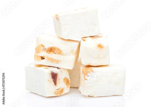 Nut nougat bar traditional sweet candy on white