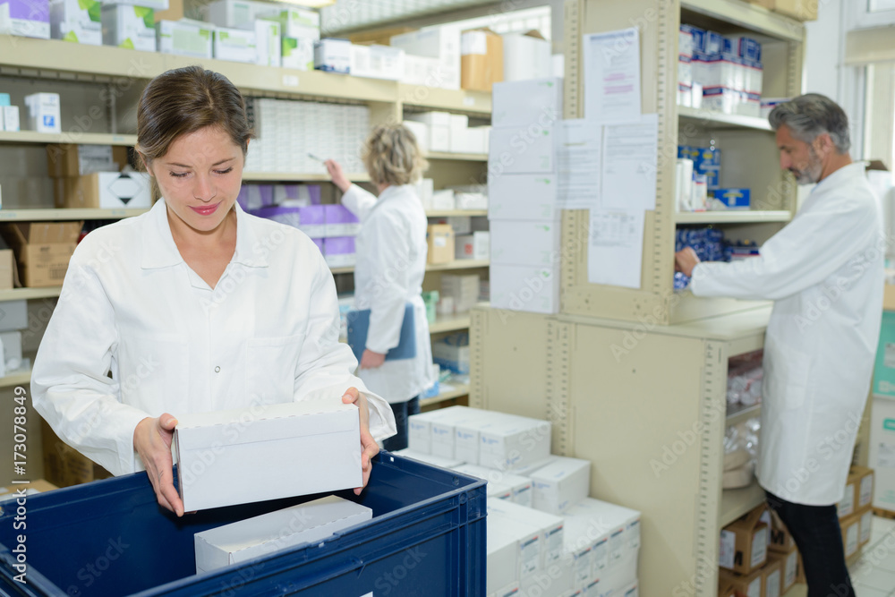 nurse and pharmacists working in pharmacy nurse and pharmacists working in pharmacy