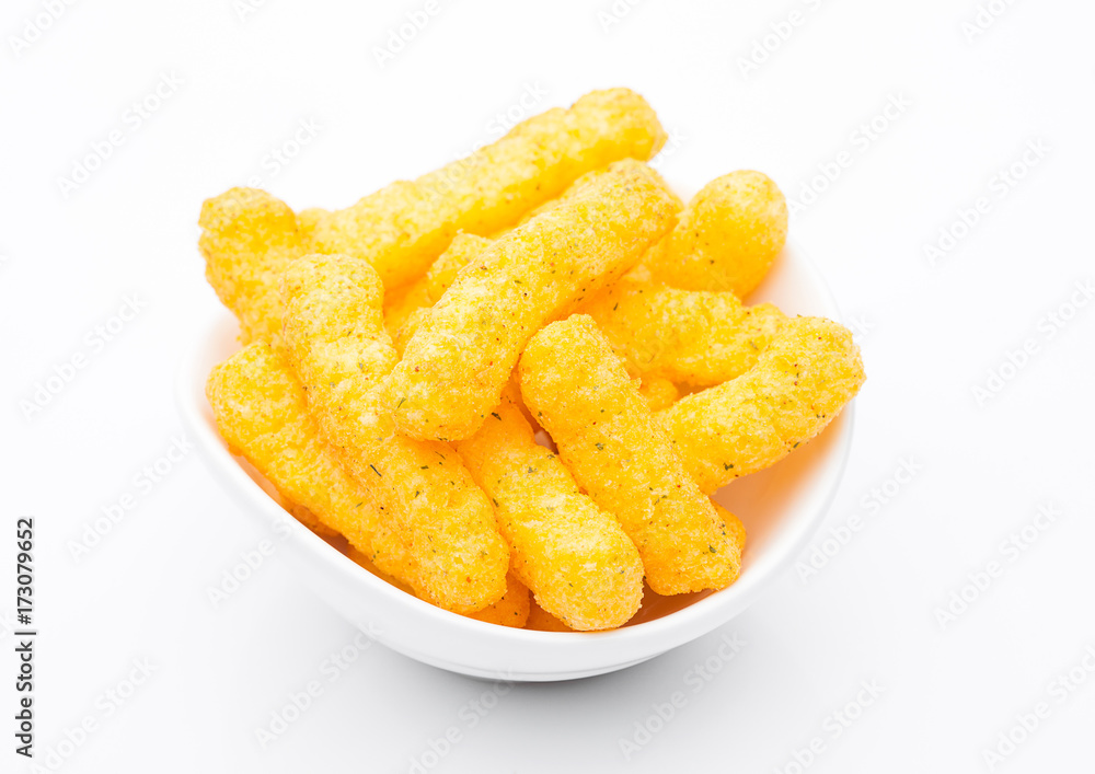 Cheese yellow corn snacks in white bowl Cheese yellow corn snacks in white bowl