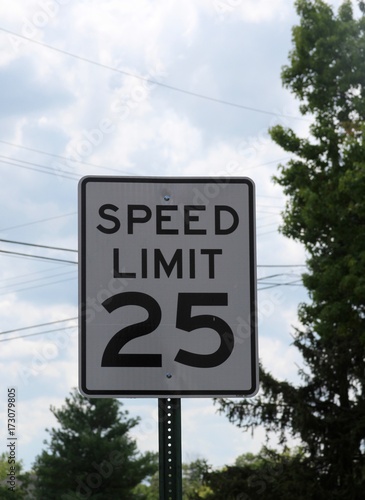 The speed limit sign on a close up view.