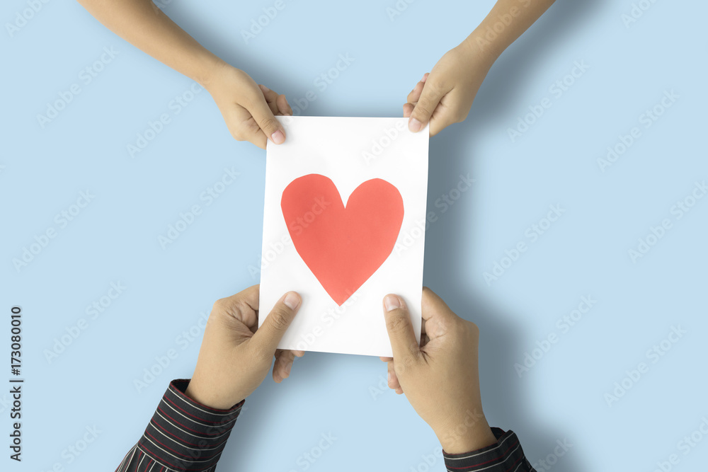 Kid and father holding greeting card Kid and father holding greeting card