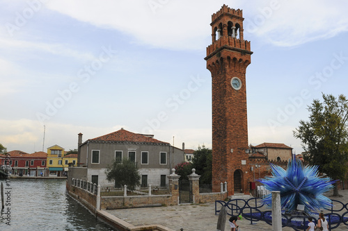 The bell tower with clock on Morano island, Venice, Italy
