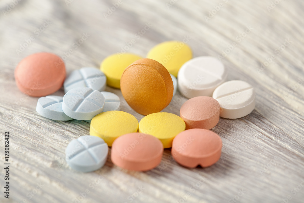 pills from pain on a wooden background pills from pain on a wooden background