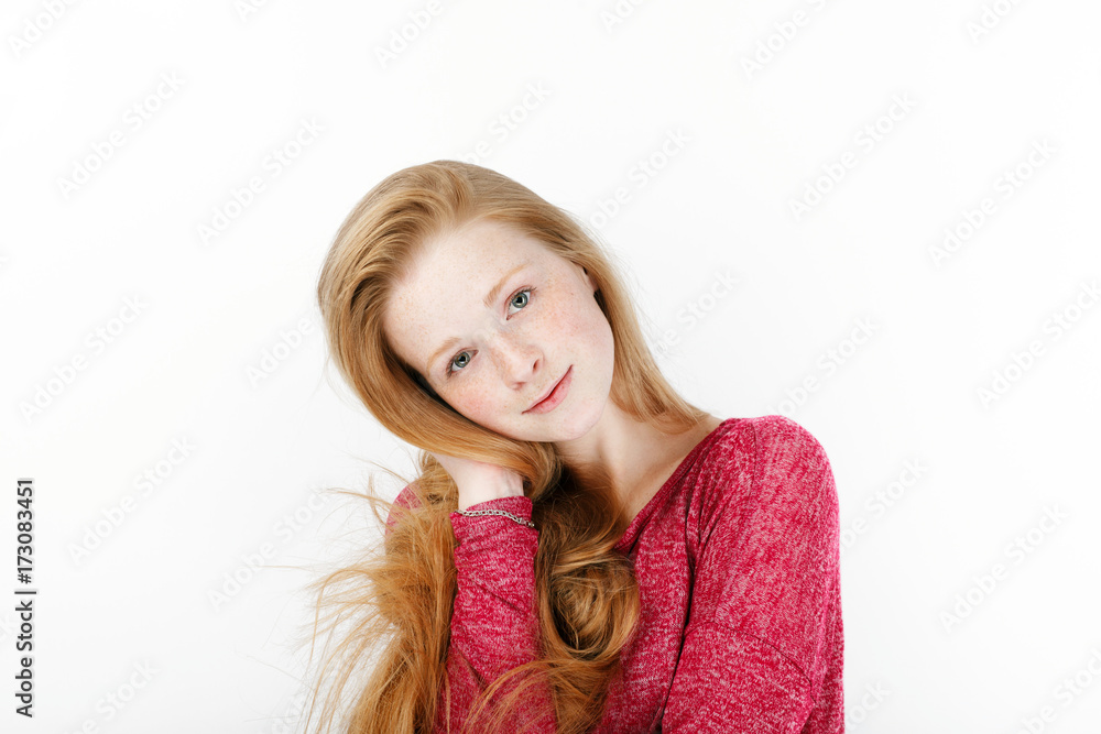 Beauty portrait of young adorable fresh looking redhead woman with gorgeous extra long hair. Emotion and facial expression concept. Beauty portrait of young adorable fresh looking redhead woman with gorgeous extra long hair. Emotion and facial expression concept.