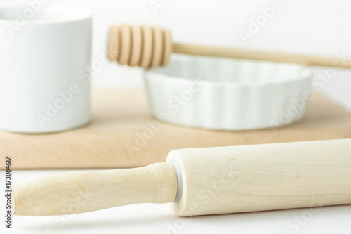 Wooden Rolling Pin Honey Dipper White Baking Form Measuring Cup on Table Pastry Holiday Cooking Bakery Concept Clean Minimalist Template for Poster Banner Copy Space Toned