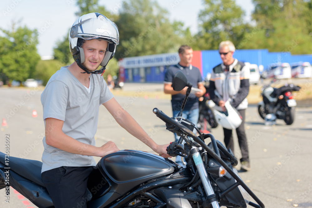 young motorcyclist gets ready to start exercise young motorcyclist gets ready to start exercise