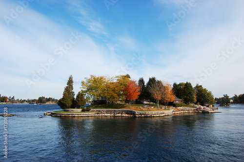 One Island in Thousand Islands Region in fall of New York State, USA. photo