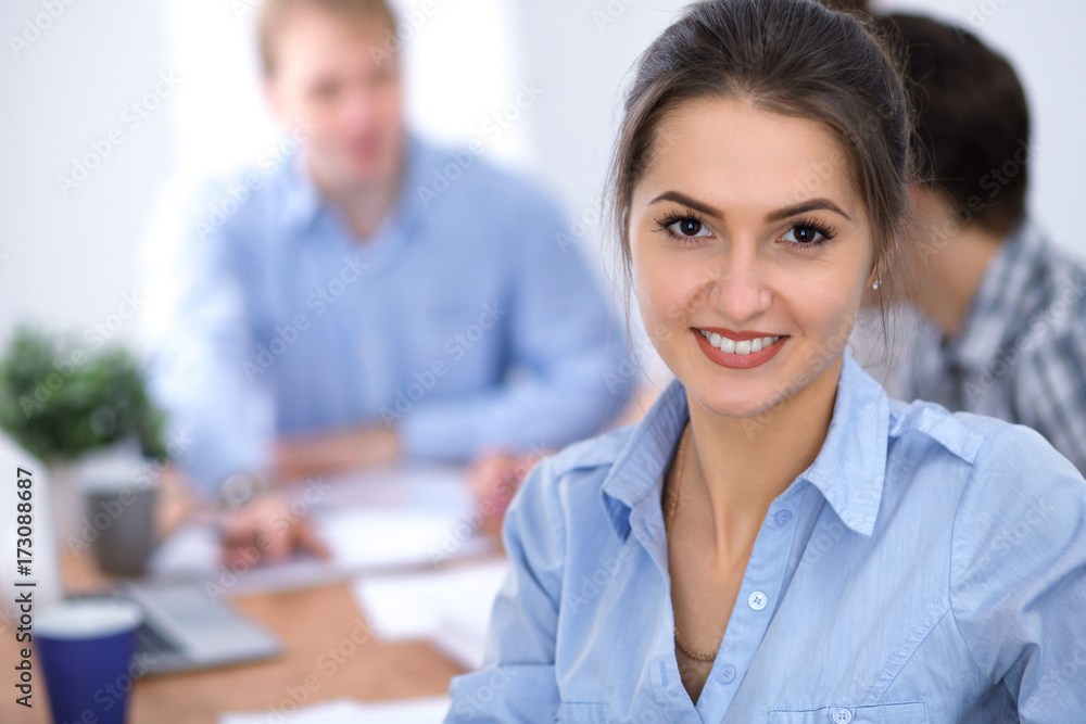 Beautiful business woman on the background of business people. Start up team. Beautiful business woman on the background of business people. Start up team.