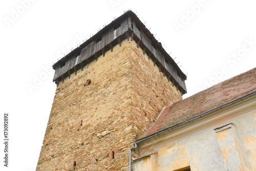 Fortified medieval saxon church in the village Barcut, Bekokten, Brekolten,Transylvania,Romania photo