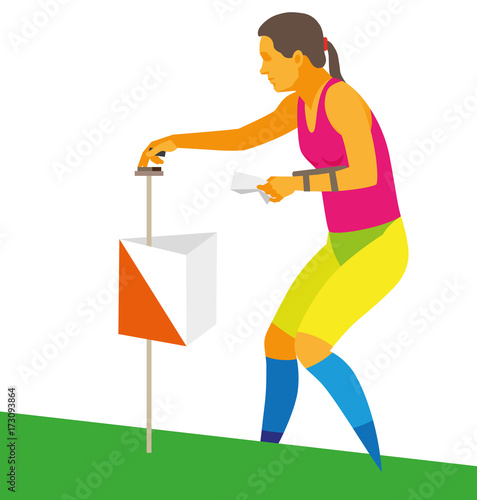 Young woman athlete engaged in orienteering makes a mark at a checkpoint in field photo