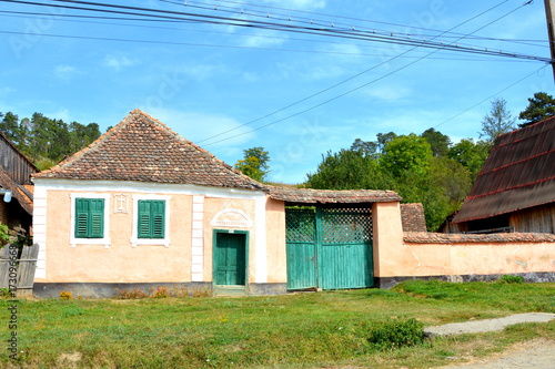 Typical rural landscape and peasant houses in Bradeni, Henndorf, Hegendorf,  Transylvania, Romania. The settlement was founded by the Saxon colonists in the middle of the 12th century photo