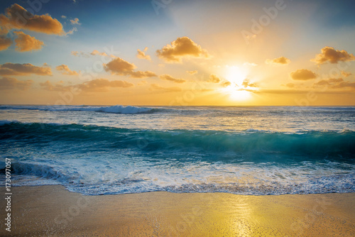 Golden hour sunset and a crashing wave