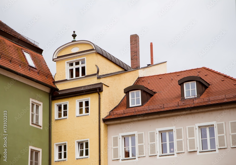 Walls, roofs and windows of typical German town buildings in Regensburg,