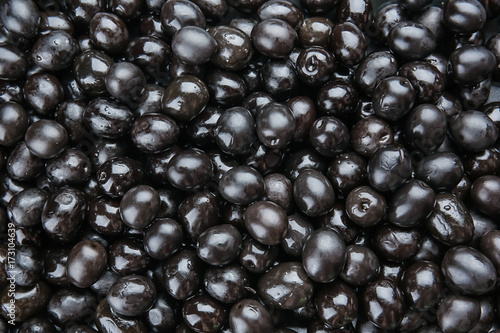 Tablou pe pânză Canned black olives as background