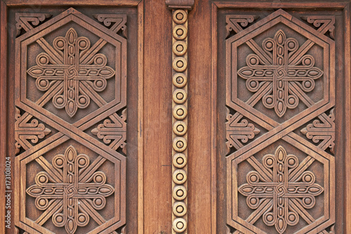 Beautiful ornaments on the wooden church doors in armenian medieval monastery Geghard close up        photo