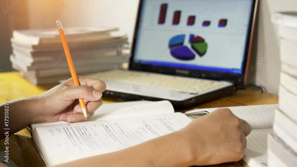 Education and learning concept, student or woman reading book and taking notes.
Education and learning concept, student or woman reading book and taking notes.
