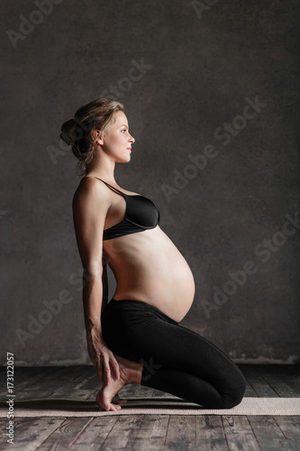 Young beautiful  pregnant yoga posing in studio © Alexander Y