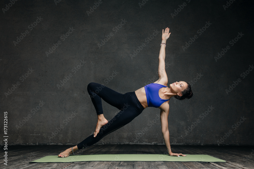 Young beautiful yoga female posing in studio Young beautiful yoga female posing in studio