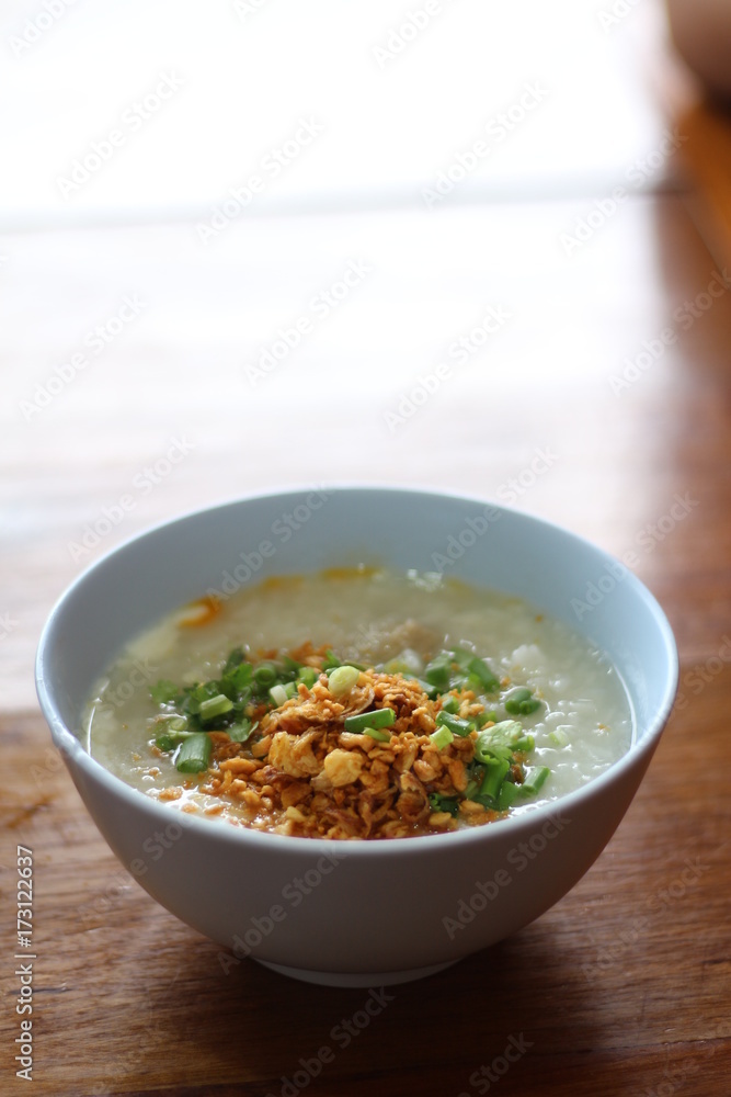 Mushroom soup in ceramic bowl on wooden background Mushroom soup in ceramic bowl on wooden background