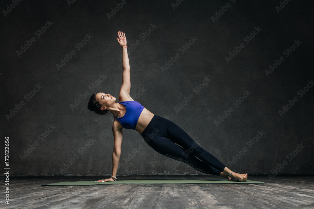 Young beautiful yoga female posing in studio Young beautiful yoga female posing in studio