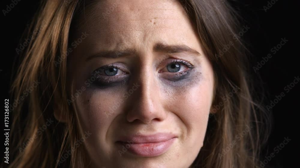 Studio Portrait Shot Of Unhappy Woman With Smudged Make Up Studio Portrait Shot Of Unhappy Woman With Smudged Make Up