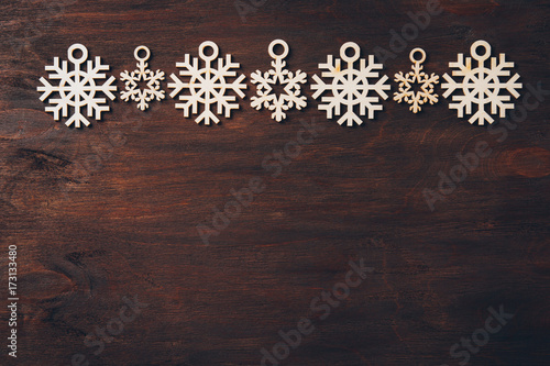 Wooden snowflakes on a dark background