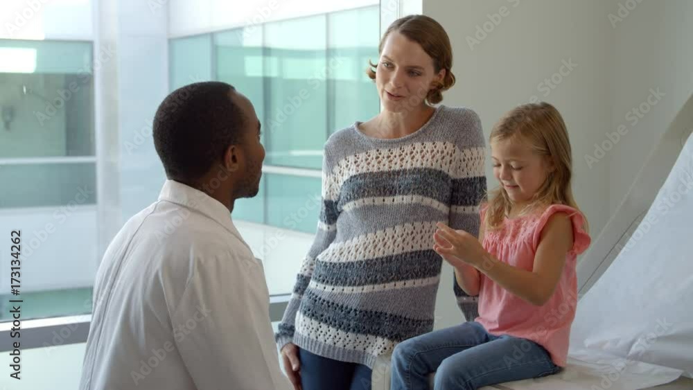 Pediatrician Meets With Mother And Daughter In Hospital Pediatrician Meets With Mother And Daughter In Hospital
