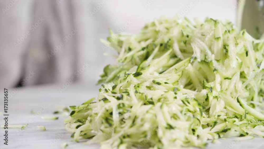 Grated zucchini on counter, close up Grated zucchini on counter, close up