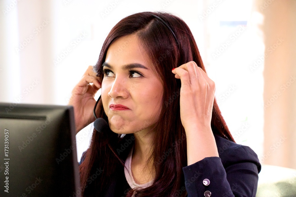 Facial expression of call center woman is negative Facial expression of call center woman is negative