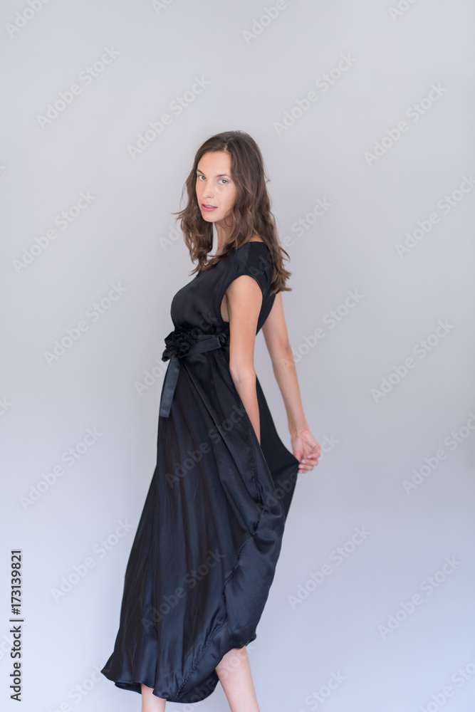 woman in a black dress isolated on white background