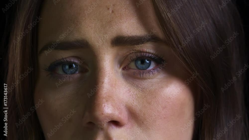 Close Up Of Unhappy Young Woman Looking Sadly Into Camera Close Up Of Unhappy Young Woman Looking Sadly Into Camera