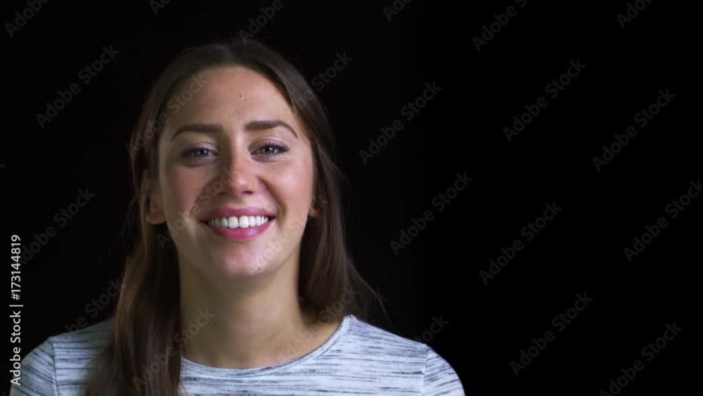 Close Up Of Attractive Young Woman Laughing Into Camera Close Up Of Attractive Young Woman Laughing Into Camera