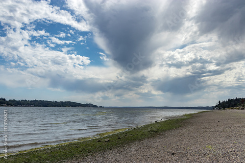 Fototapeta Naklejka Na Ścianę i Meble -  storm clouds forming over a pacific northwest beach