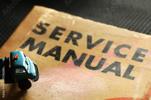 Model car scene put on the old service manual book.