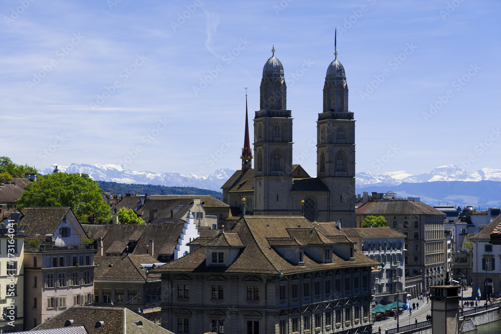 Grossmuenster church and Swiss Alps