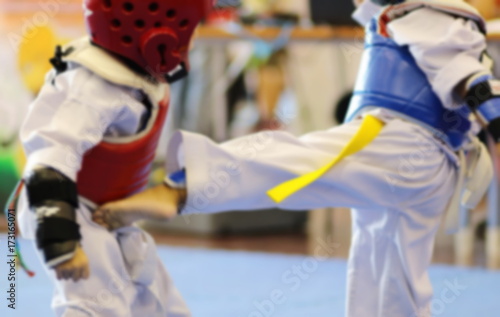 blurred background of Young Taekwondo athletes are fighting during contest