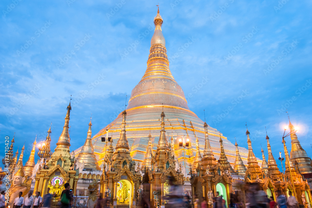 Naklejka premium Yangon, Myanmar. Sep 9, 2017. Myanmer famous sacred place and tourist attraction landmark, Shwedagon Paya pagoda illuminated in the evening.