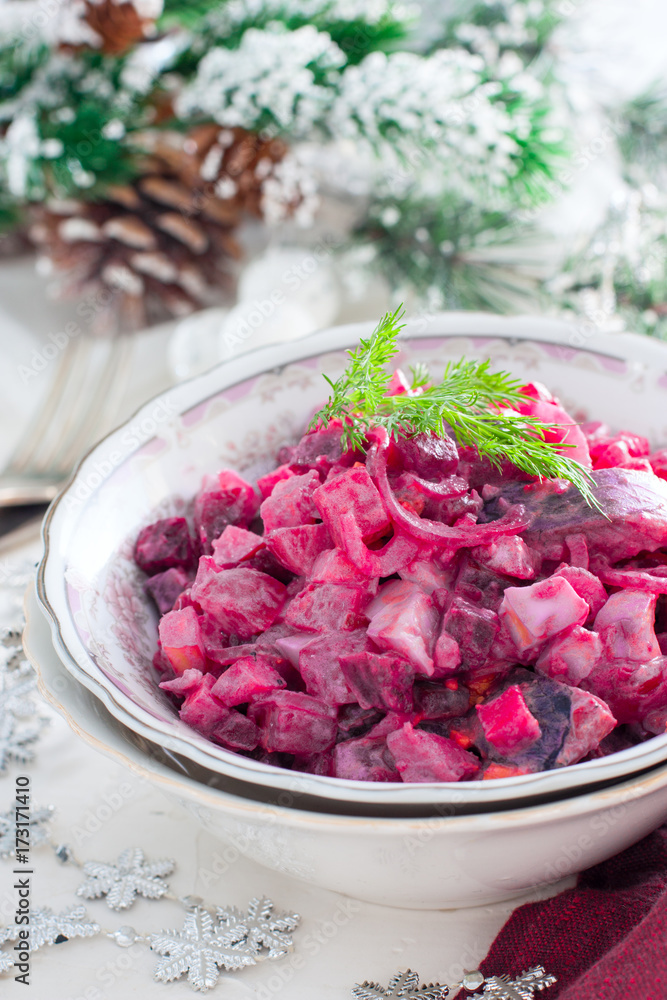 Christmas salad with beets and herring, selective focus Christmas salad with beets and herring, selective focus
