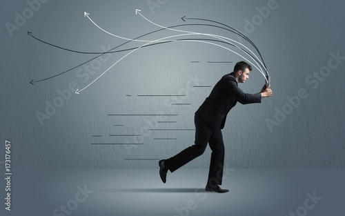 Running businessman with device and hand drawn lines