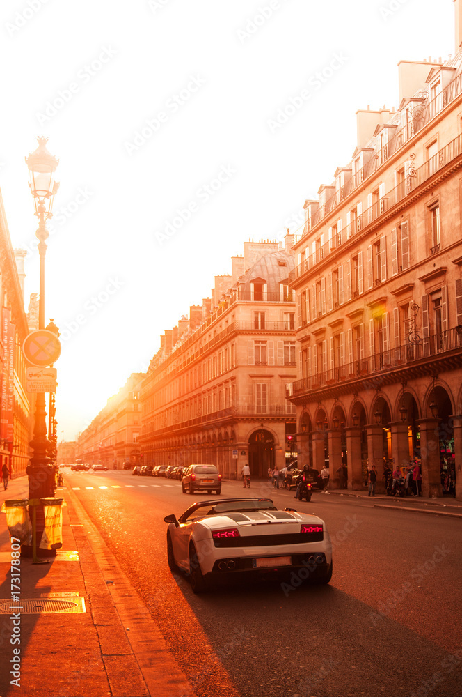 Paris street and super car at sunset